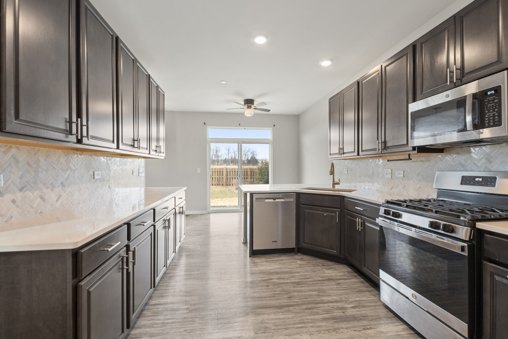 2045 Stuttle Road Batavia, IL 60510 - Photo 8 of 18 a kitchen with stainless steel appliances granite countertop a stove and a sink