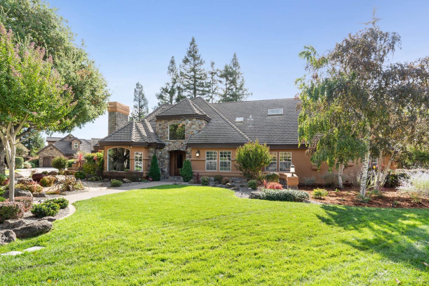 2395 Ric Drive Gilroy, CA 95020 - Photo 11 of 100 a view of a house with a big yard and large trees