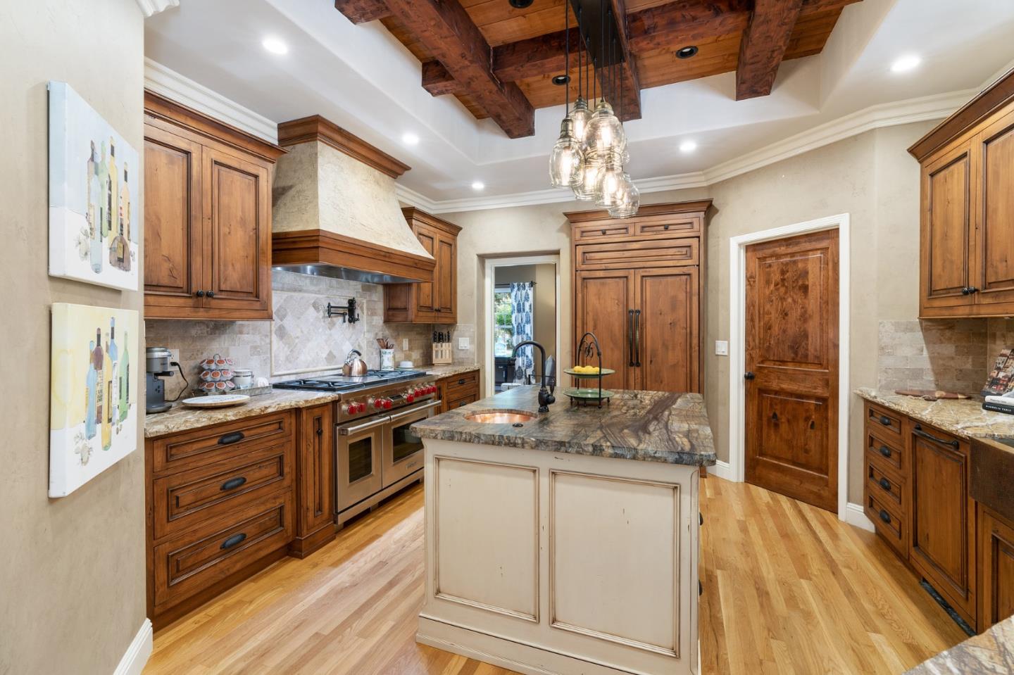 2395 Ric Drive Gilroy, CA 95020 - Photo 24 of 100 a kitchen with stainless steel appliances granite countertop a stove top oven a sink dishwasher a dining table and chairs with wooden floor