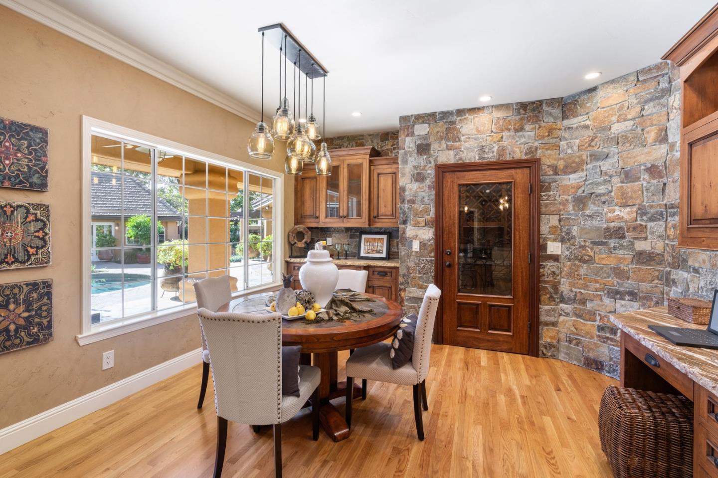 2395 Ric Drive Gilroy, CA 95020 - Photo 36 of 100 a dining room with furniture a chandelier and wooden floor