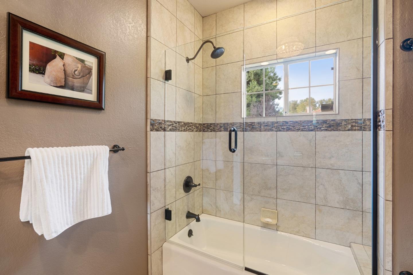 2395 Ric Drive Gilroy, CA 95020 - Photo 65 of 100 a bathroom with a bathtub and a shower