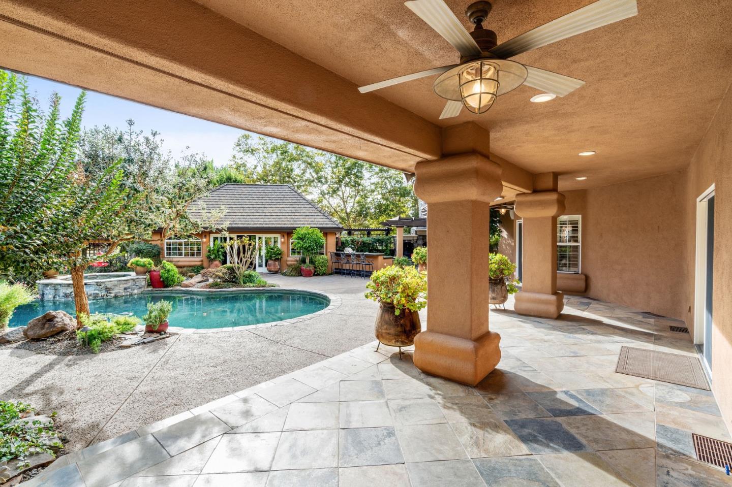 2395 Ric Drive Gilroy, CA 95020 - Photo 76 of 100 a view of a patio with a table and chairs under an umbrella