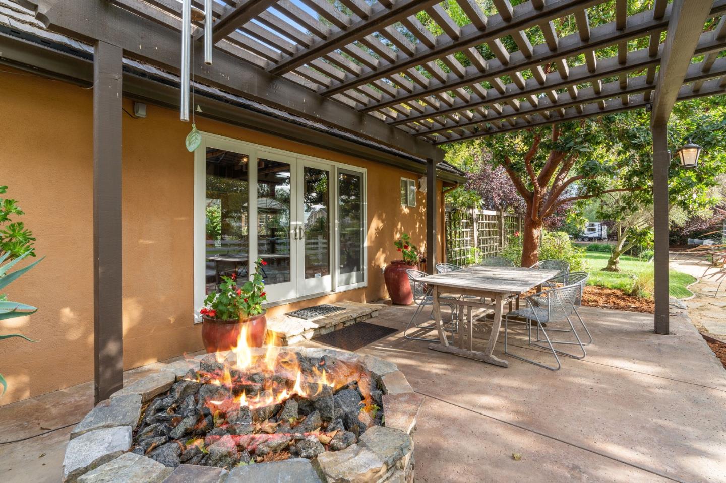 2395 Ric Drive Gilroy, CA 95020 - Photo 91 of 100 a view of a patio with table and chairs and potted plants