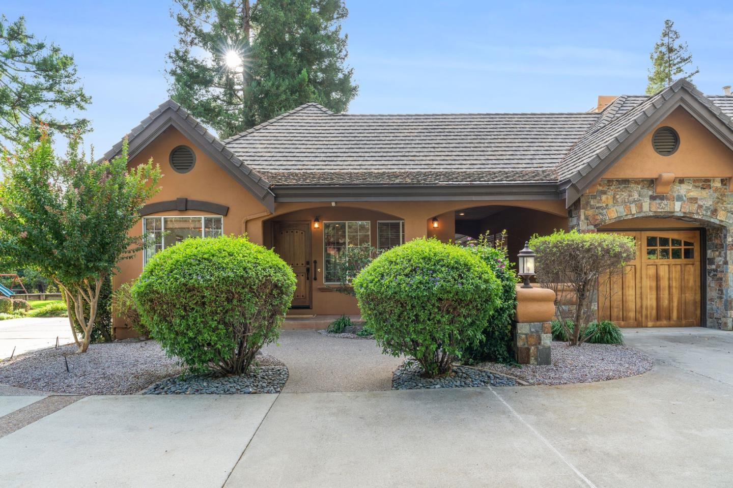 2395 Ric Drive Gilroy, CA 95020 - Photo 99 of 100 a view of a house with large windows and a garage