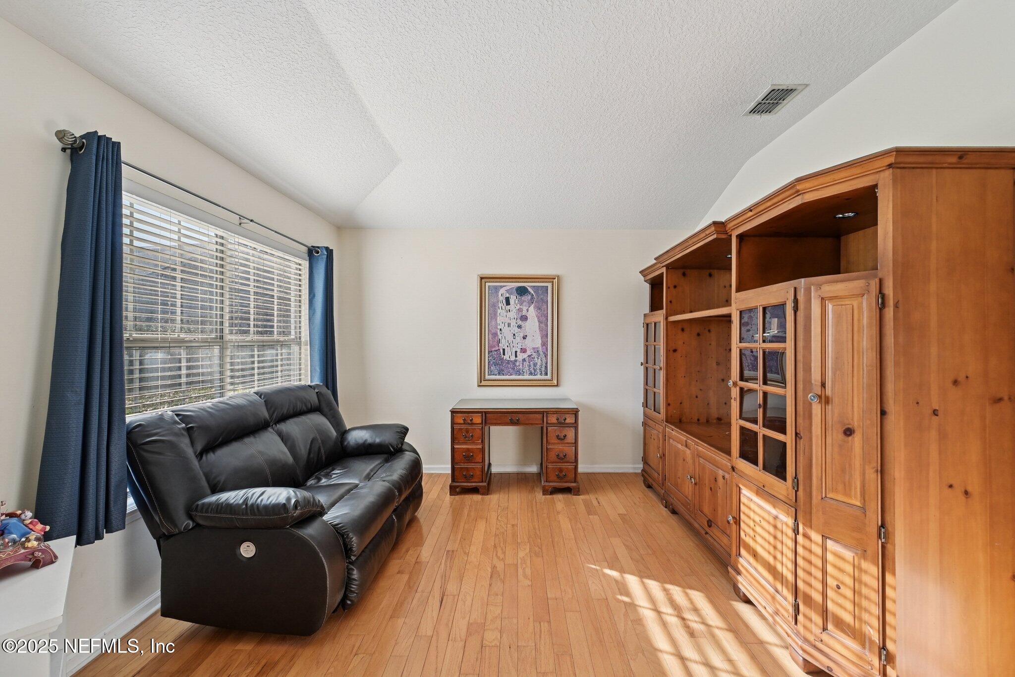 1862 Sentry Oak Court Fleming Island, FL 32003 - Photo 11 of 83 a living room with furniture and a window