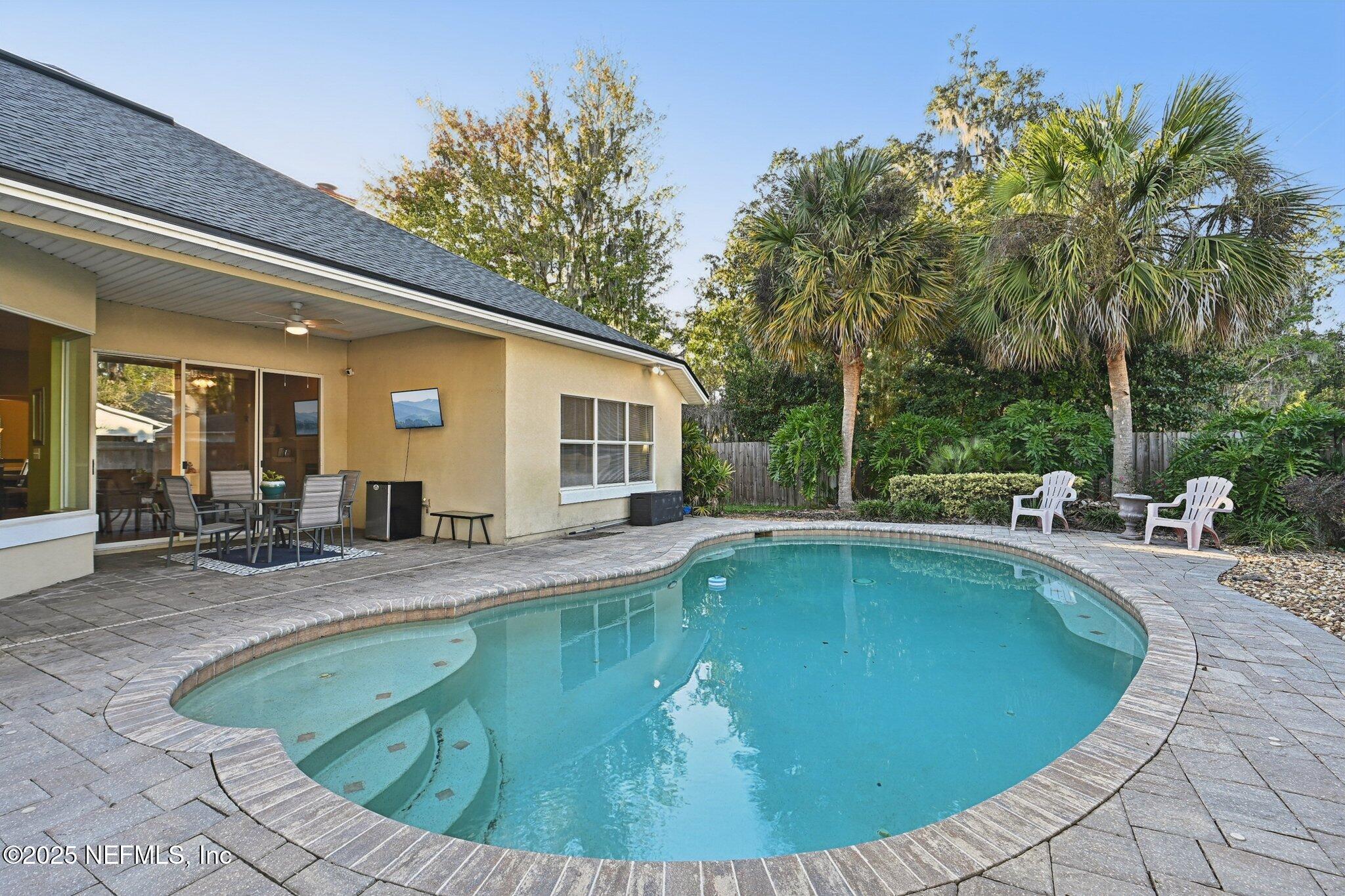 1862 Sentry Oak Court Fleming Island, FL 32003 - Photo 22 of 83 a view of a house with swimming pool and sitting area