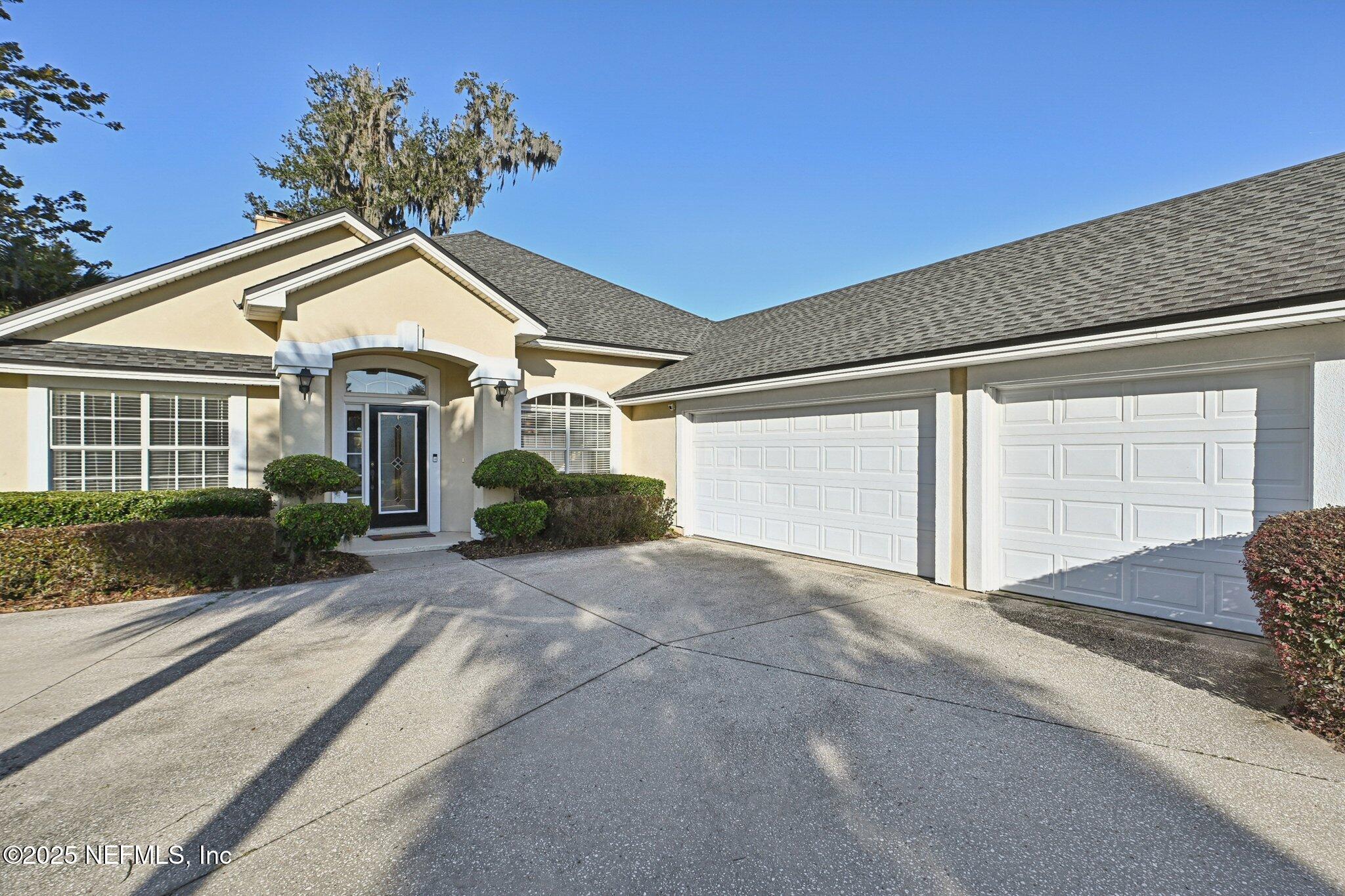 1862 Sentry Oak Court Fleming Island, FL 32003 - Photo 28 of 83 a view of a house with a yard
