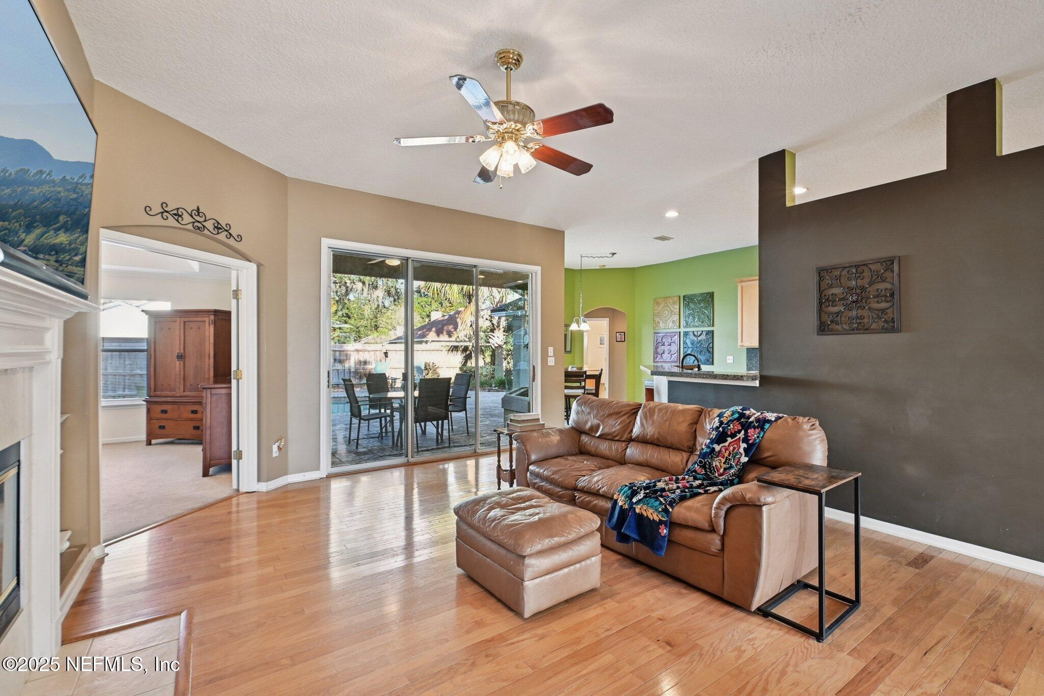 1862 Sentry Oak Court Fleming Island, FL 32003 - Photo 33 of 83 a living room with furniture and wooden floor