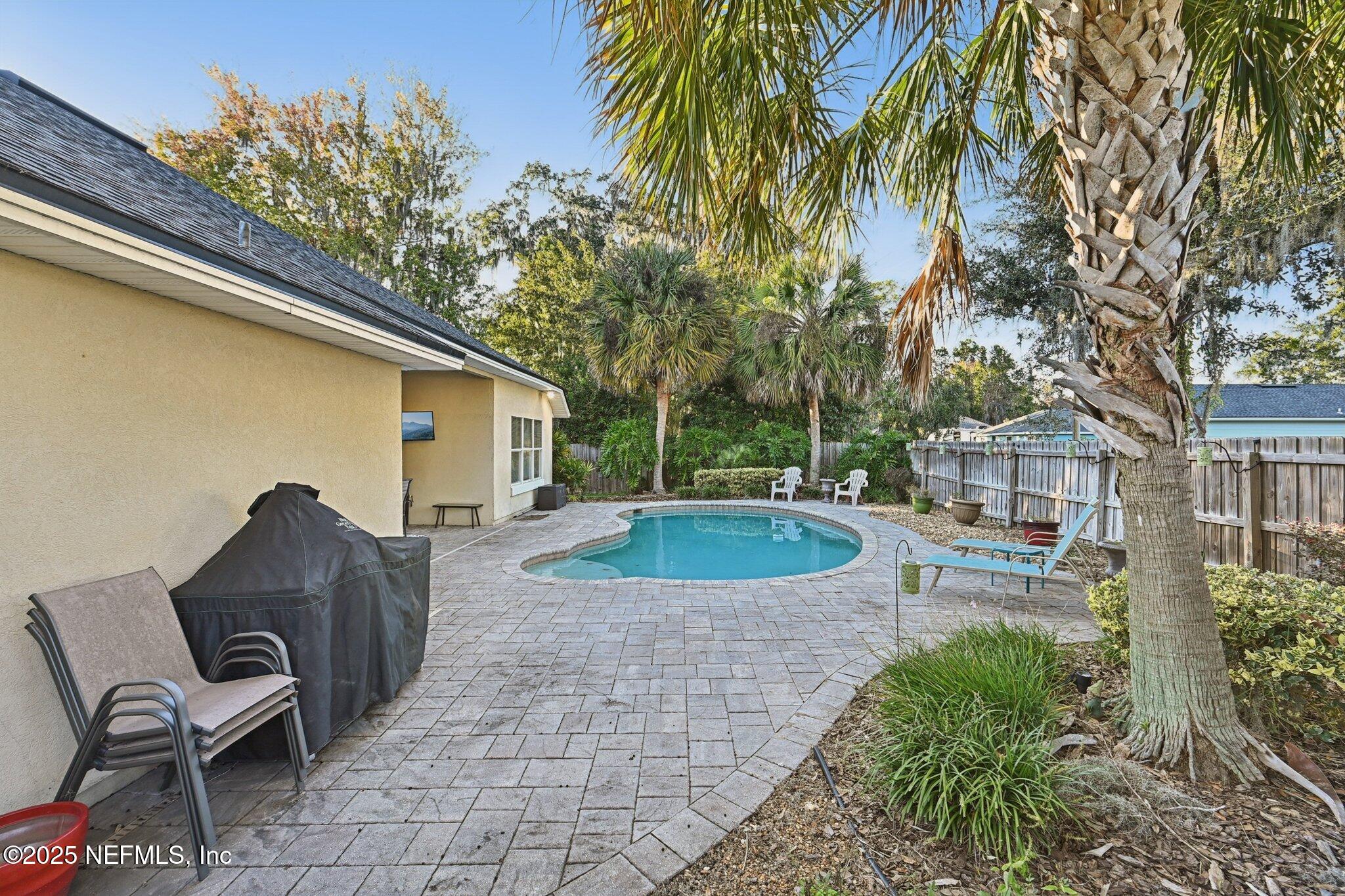 1862 Sentry Oak Court Fleming Island, FL 32003 - Photo 49 of 83 a view of a house with backyard and sitting area