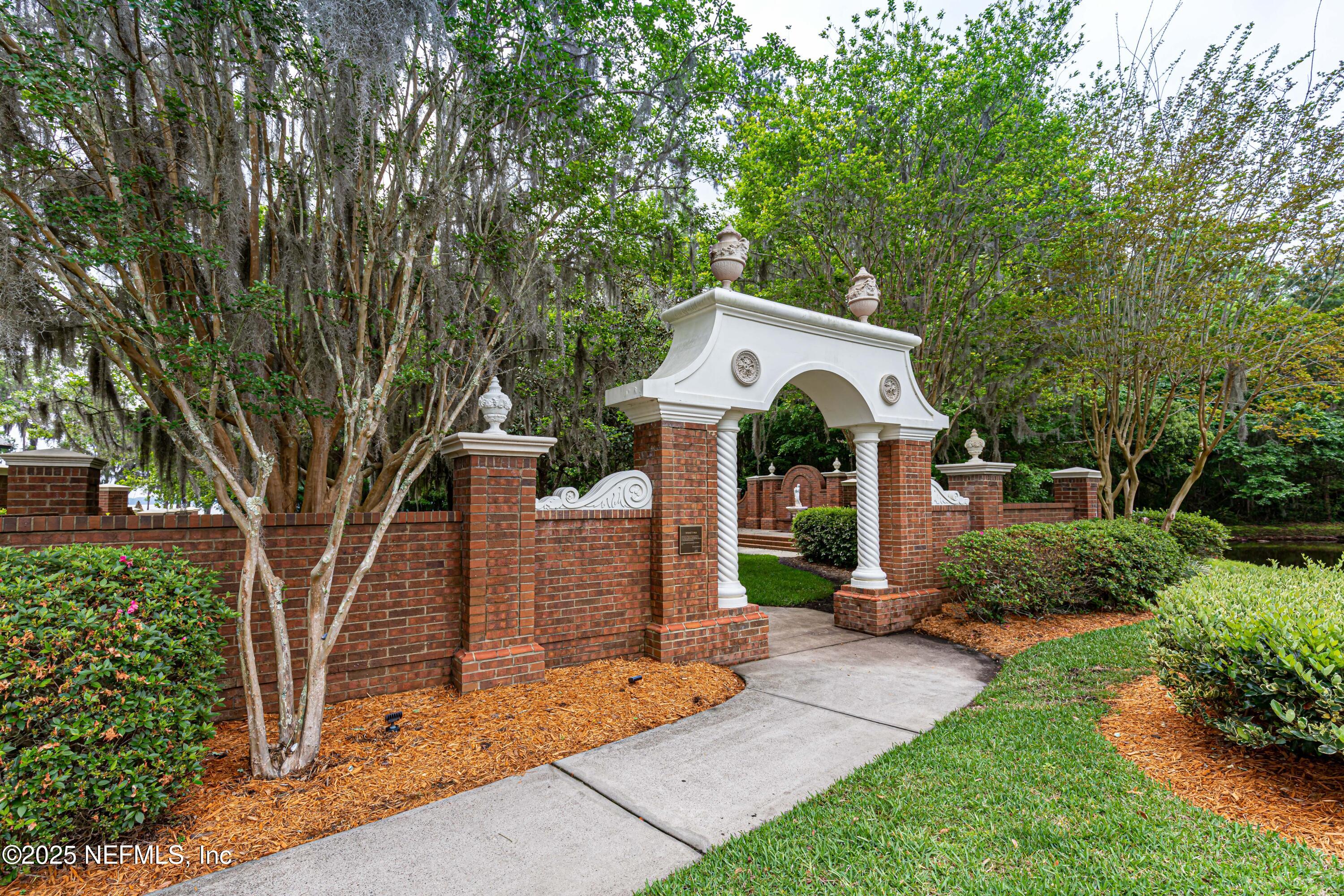 1862 Sentry Oak Court Fleming Island, FL 32003 - Photo 58 of 83 a front view of a house with garden