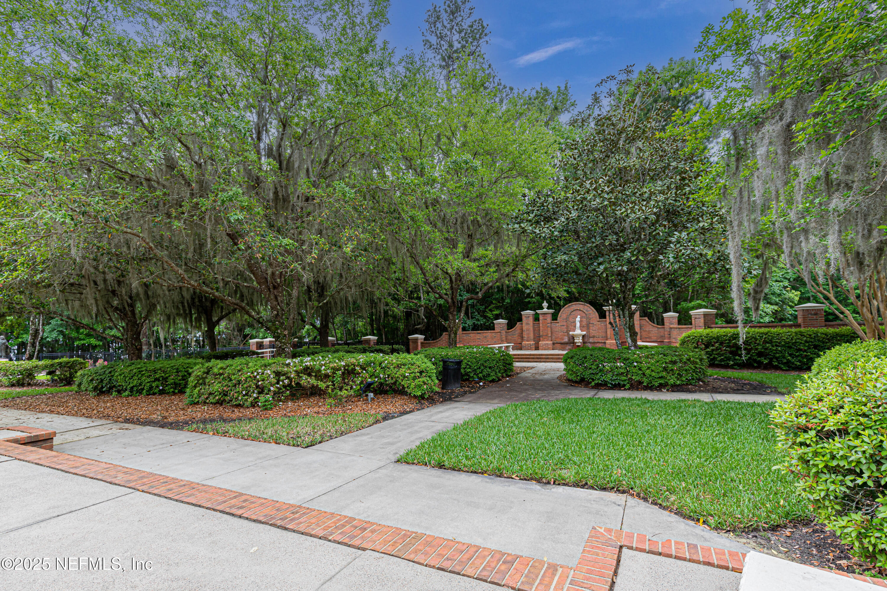 1862 Sentry Oak Court Fleming Island, FL 32003 - Photo 60 of 83 a view of a garden with plants and large trees