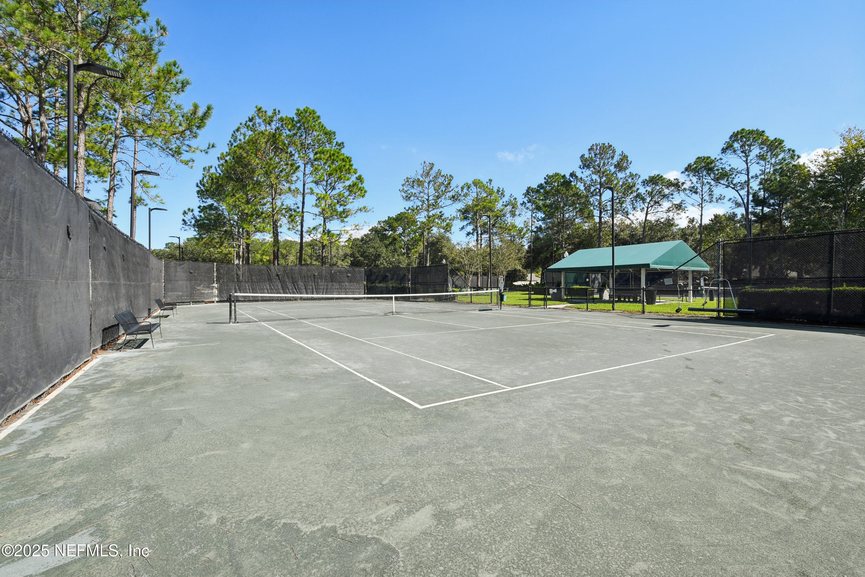 1862 Sentry Oak Court Fleming Island, FL 32003 - Photo 74 of 83 a view of a tennis ground with large trees