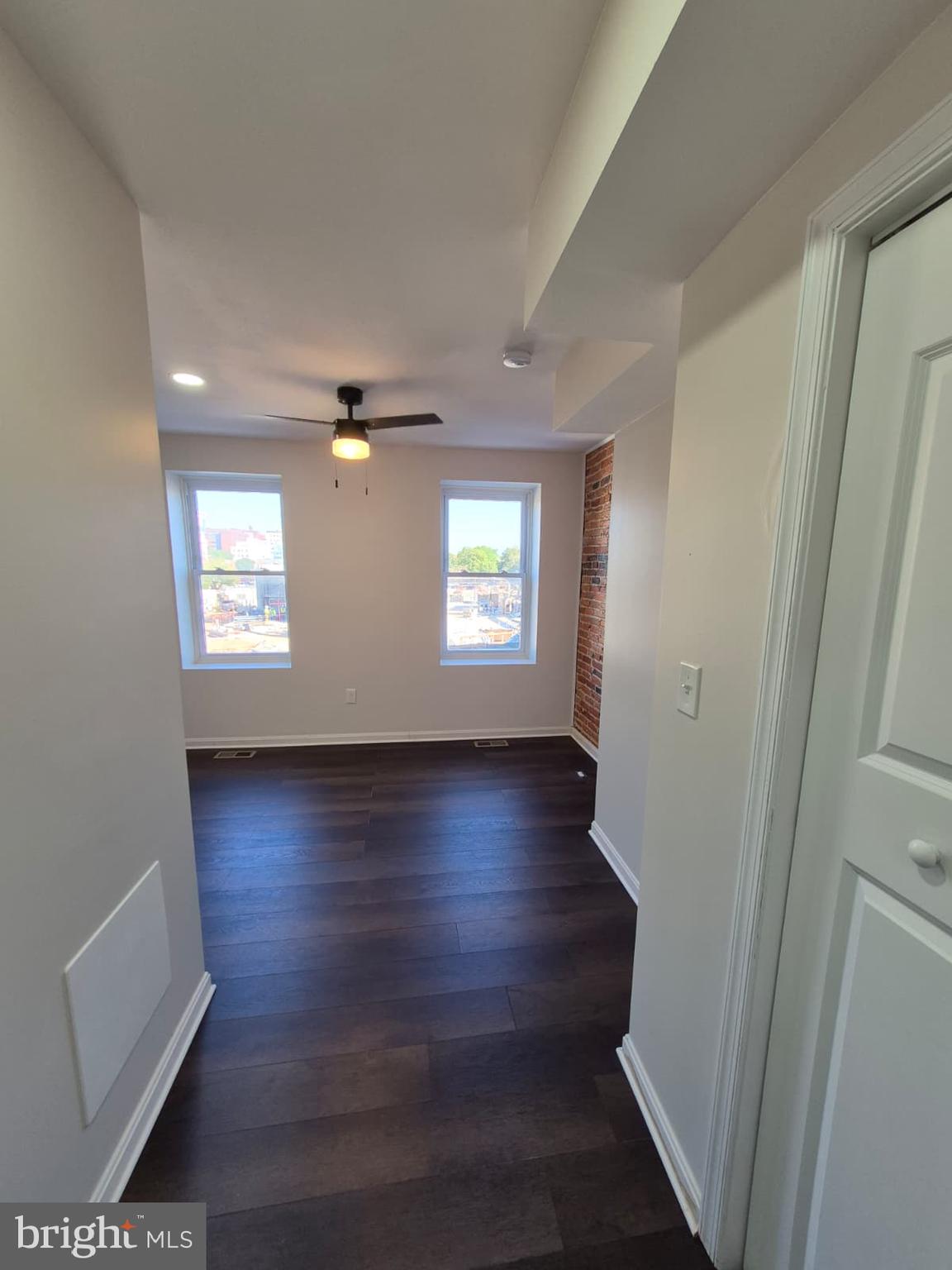 2015 East Fairmount Avenue Baltimore, MD 21231 - Photo 17 of 27 an empty room with wooden floor and windows