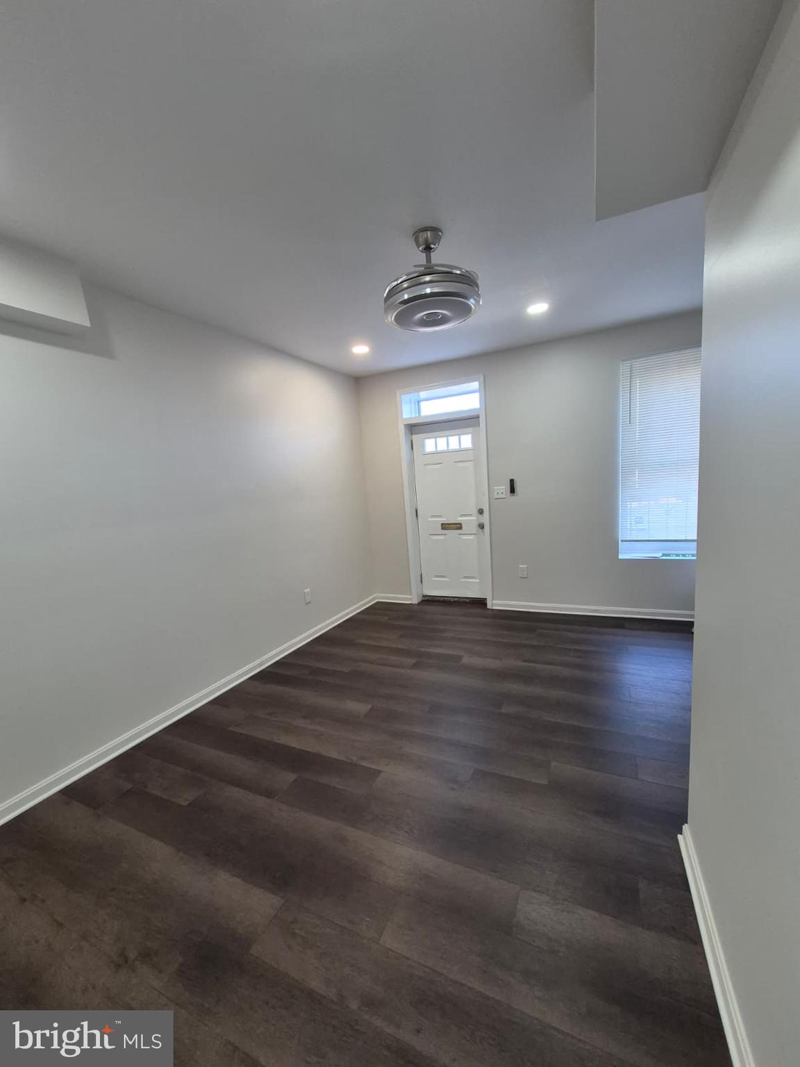 2015 East Fairmount Avenue Baltimore, MD 21231 - Photo 8 of 27 an empty room with wooden floor and windows