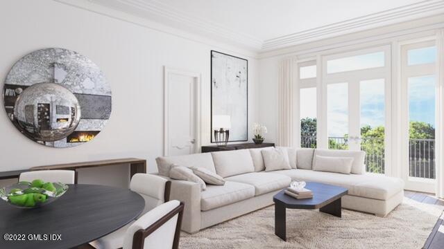 62 Mason Street, Unit PH E Greenwich, CT 06830 - Photo 4 of 7 a living room with furniture and a large window