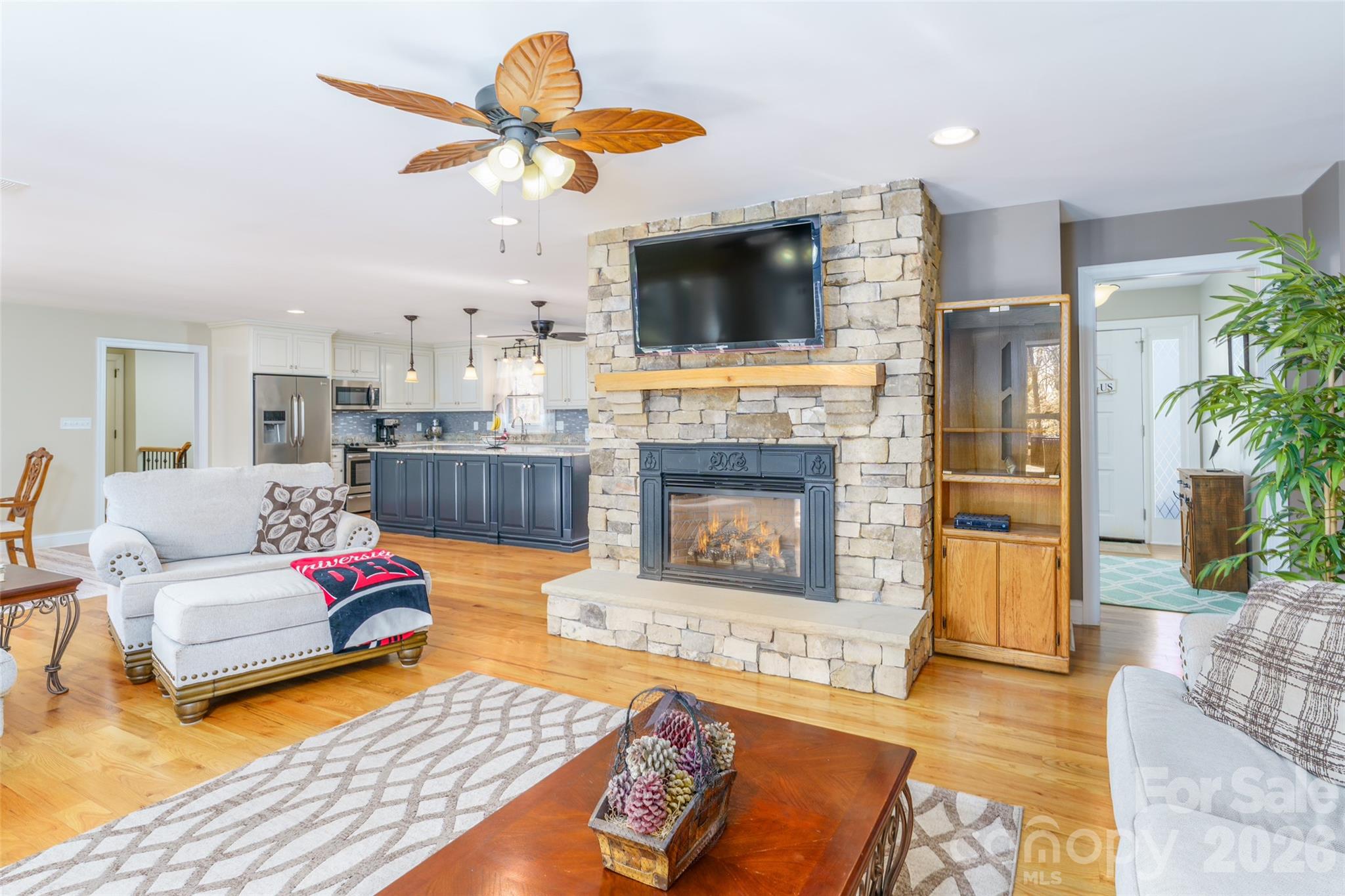 8194 Mallard Road Denver, NC 28037 - Photo 11 of 48 a living room with fireplace furniture and a flat screen tv