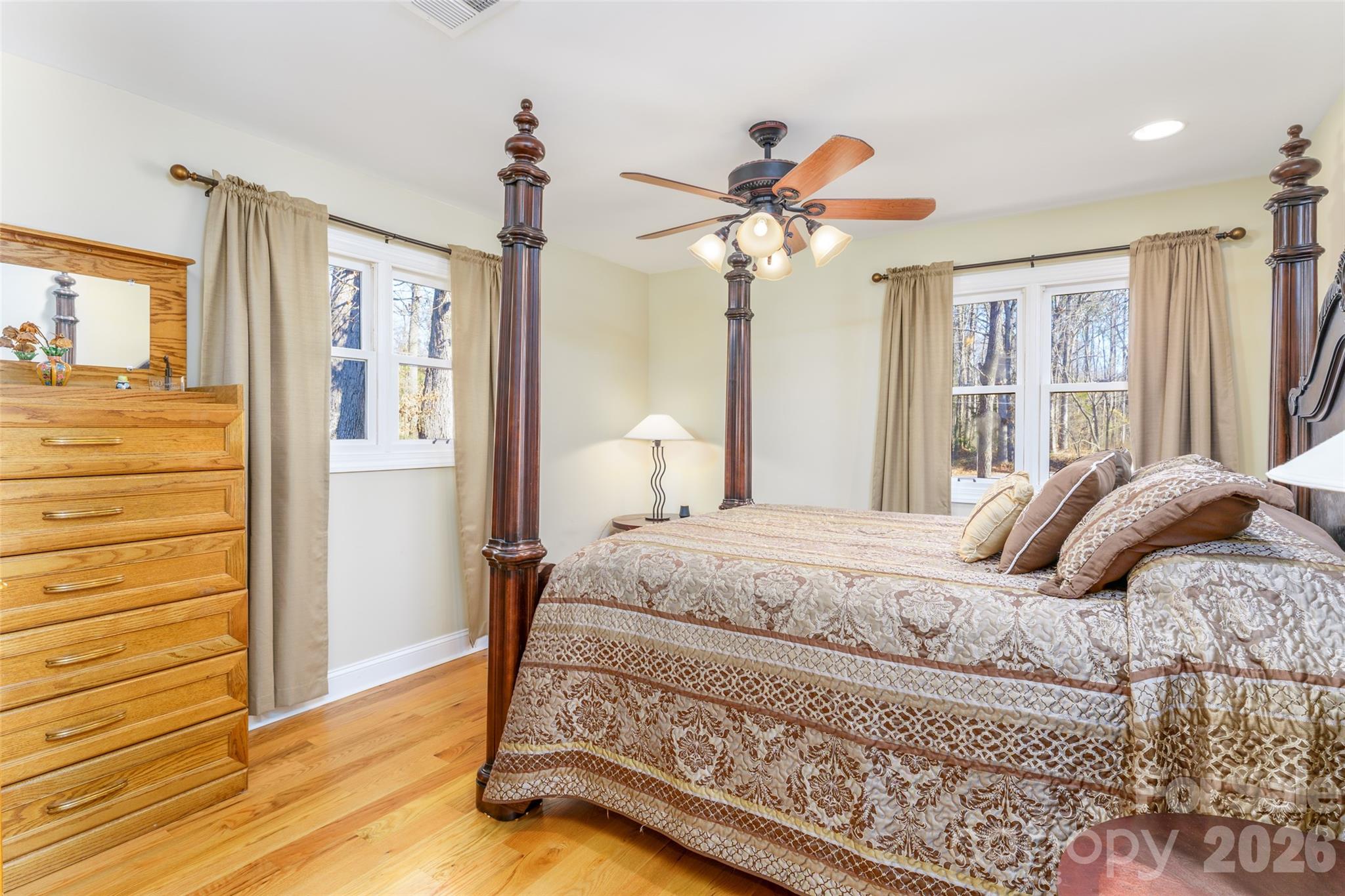 8194 Mallard Road Denver, NC 28037 - Photo 16 of 48 a bedroom with a bed and wooden floor