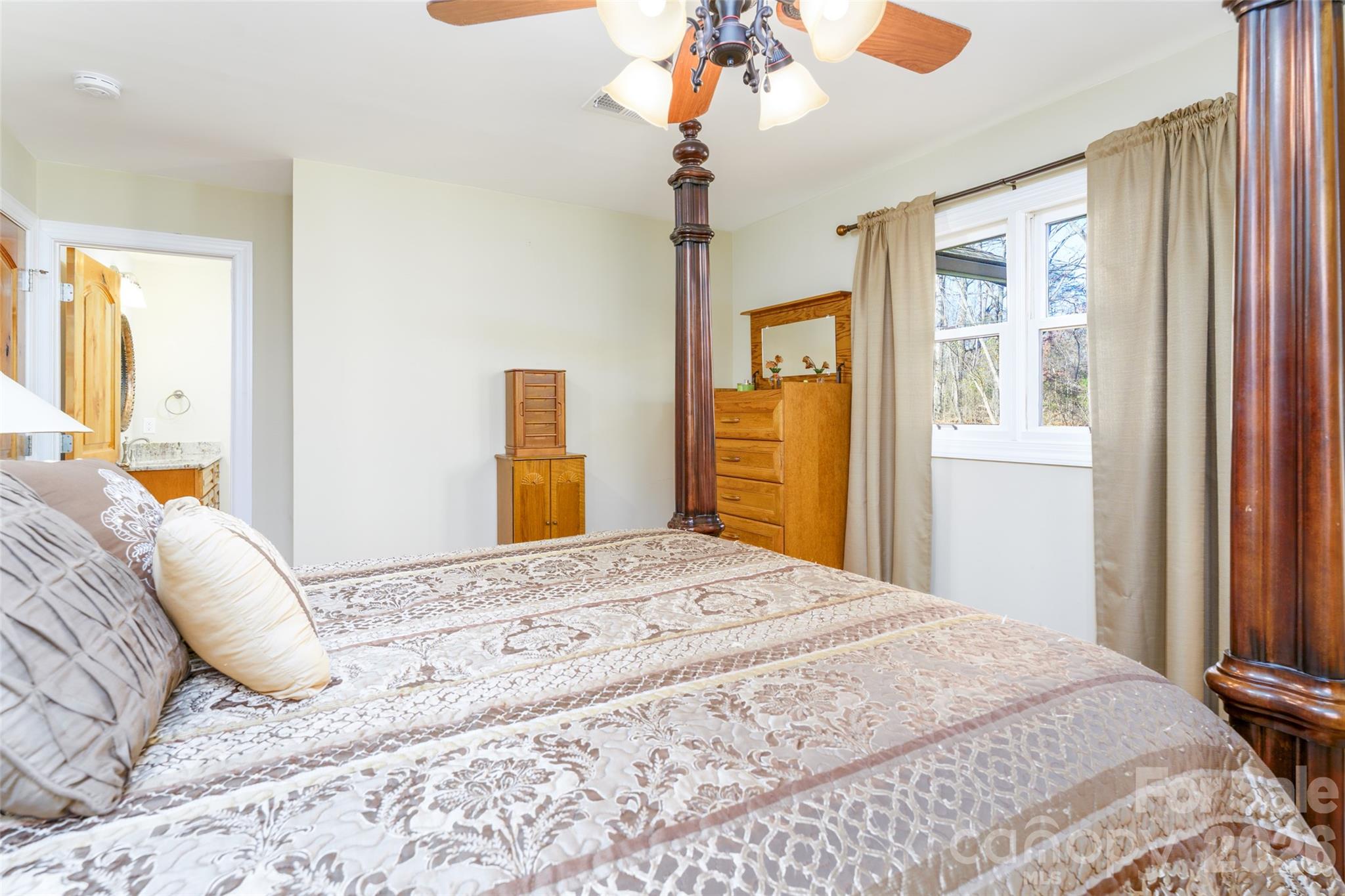 8194 Mallard Road Denver, NC 28037 - Photo 17 of 48 a bedroom with a bed dresser and a window