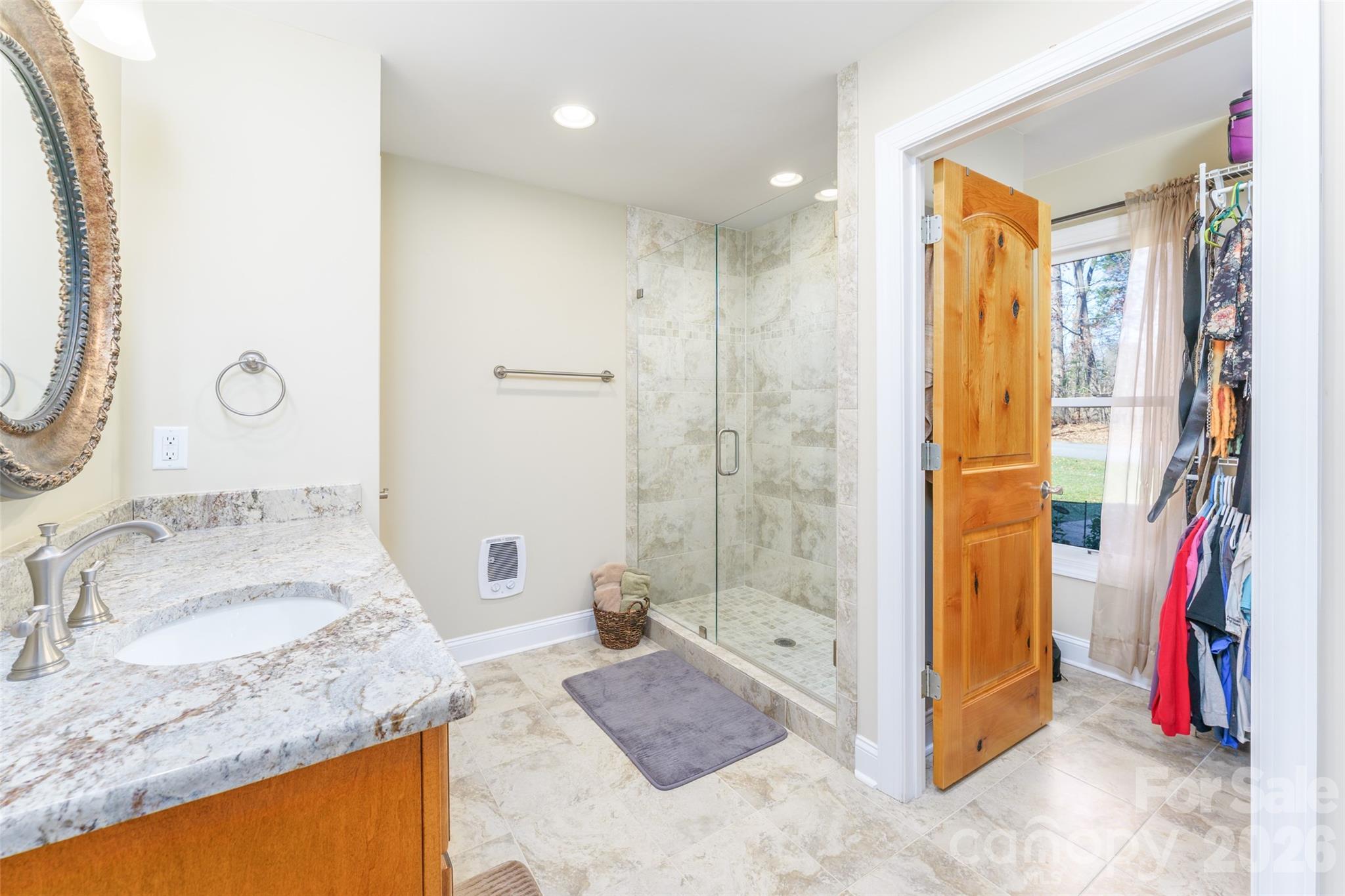 8194 Mallard Road Denver, NC 28037 - Photo 18 of 48 a bathroom with a granite countertop sink and a mirror