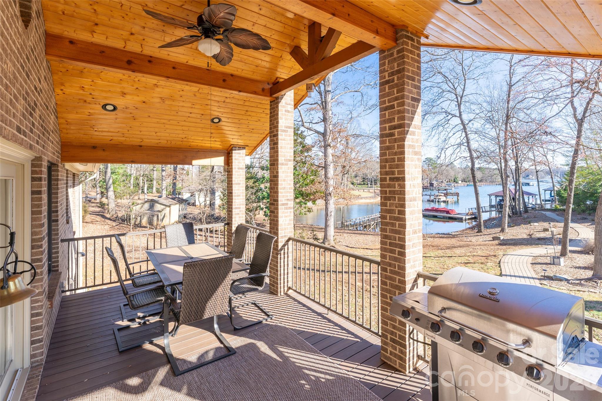 8194 Mallard Road Denver, NC 28037 - Photo 19 of 48 a view of a patio with dining table and chairs