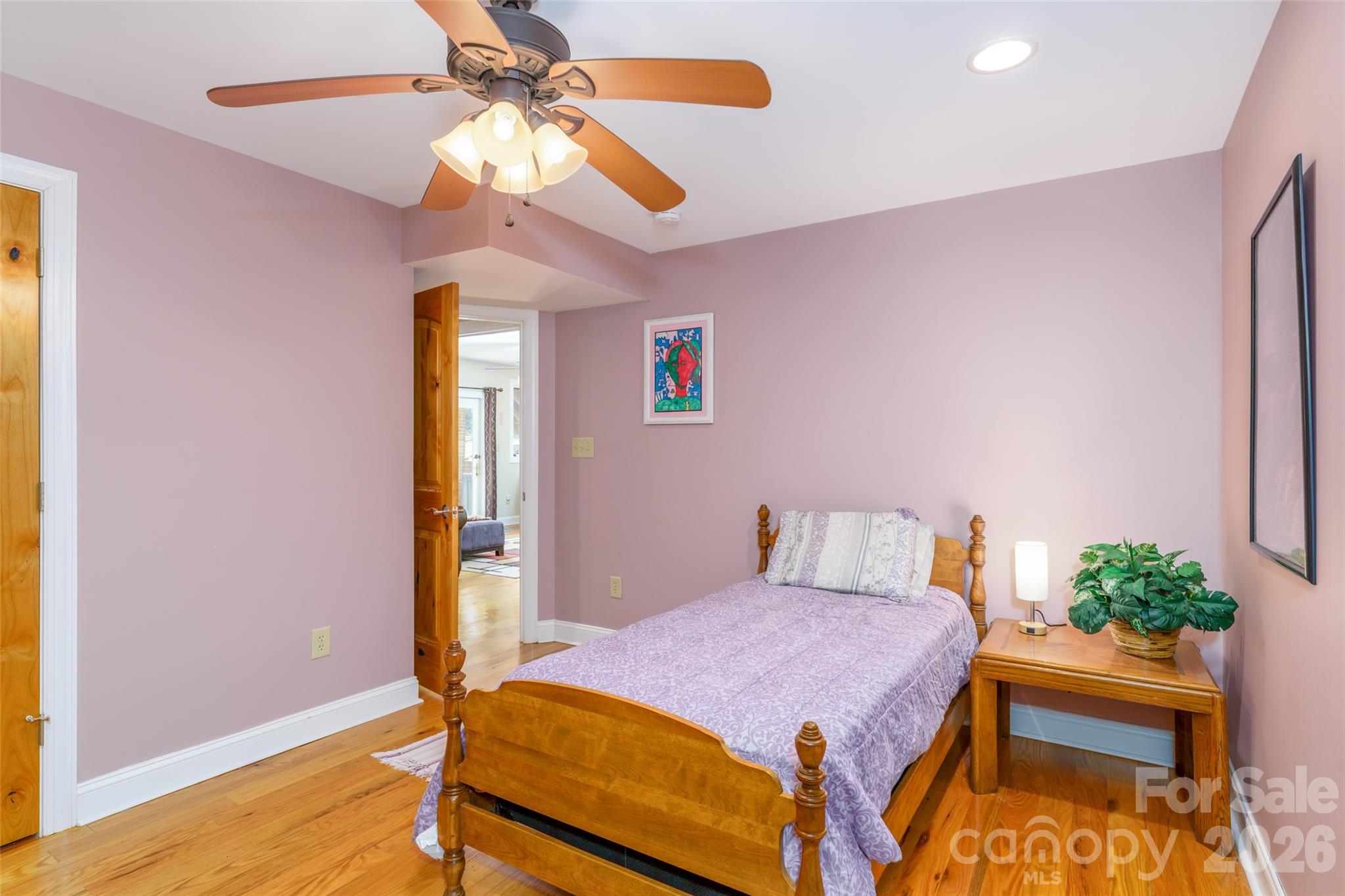 8194 Mallard Road Denver, NC 28037 - Photo 33 of 48 a bedroom with a bed and a chandelier