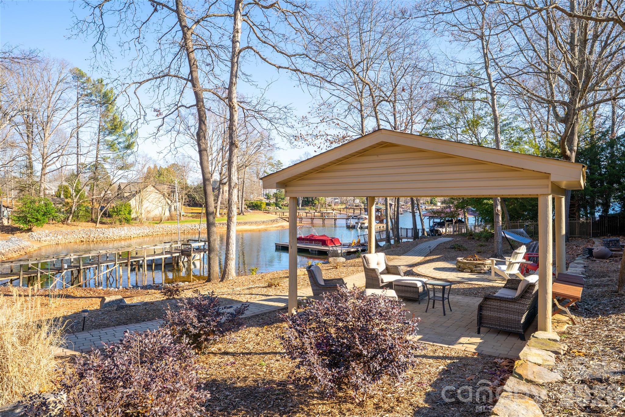 8194 Mallard Road Denver, NC 28037 - Photo 38 of 48 a view of a patio with table and chairs under an umbrella