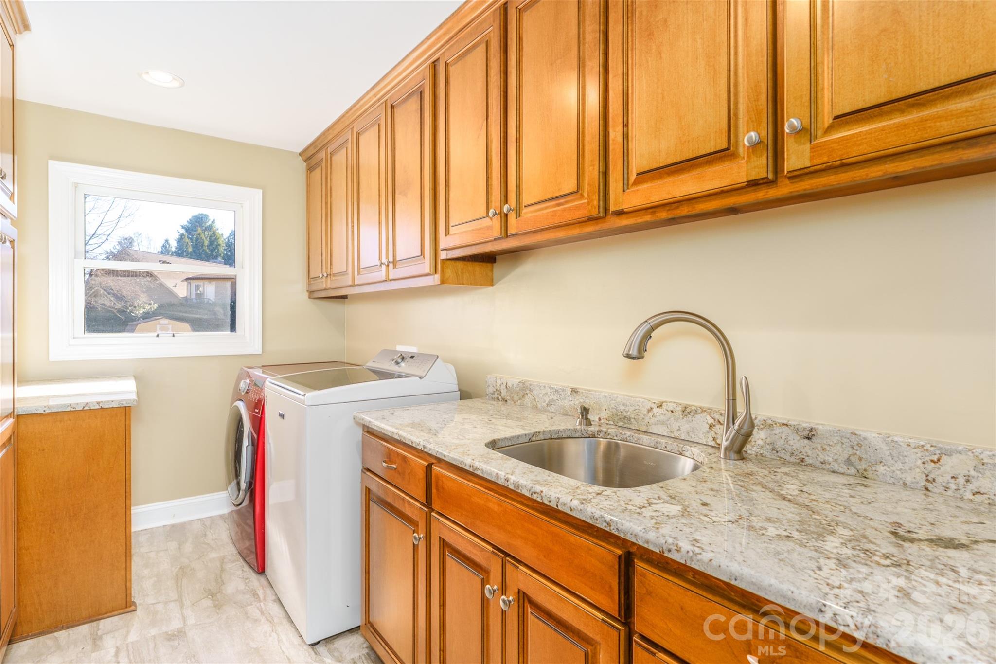 8194 Mallard Road Denver, NC 28037 - Photo 8 of 48 a kitchen with stainless steel appliances granite countertop a sink dishwasher and cabinets with wooden floor