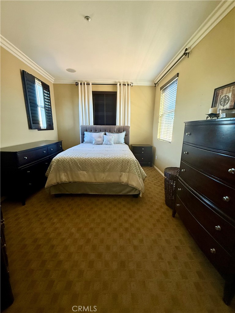 44965 Blue Rosemary Way Temecula, CA 92592 - Photo 11 of 25 a bedroom with a bed and a flat screen tv