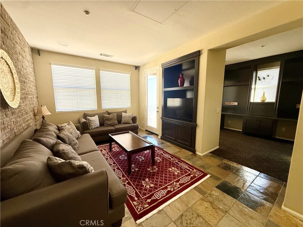 44965 Blue Rosemary Way Temecula, CA 92592 - Photo 4 of 25 a living room with furniture and a rug
