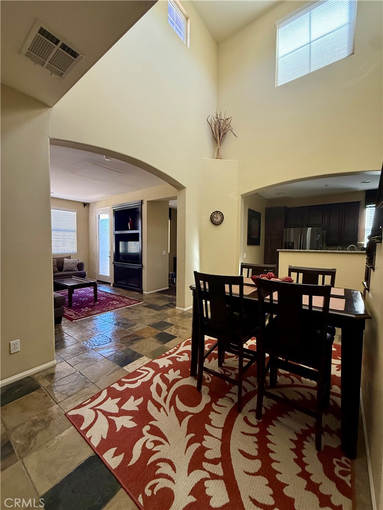 44965 Blue Rosemary Way Temecula, CA 92592 - Photo 8 of 25 a view of a dining room with furniture
