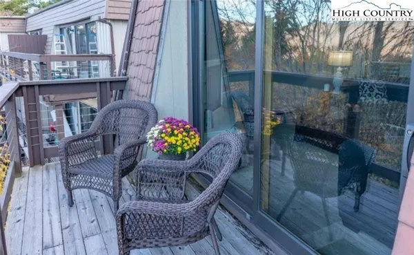 a view of balcony with a seating space
