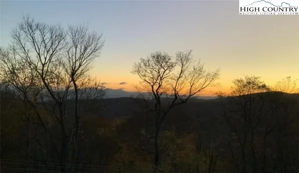a view of mountain view with lots of trees