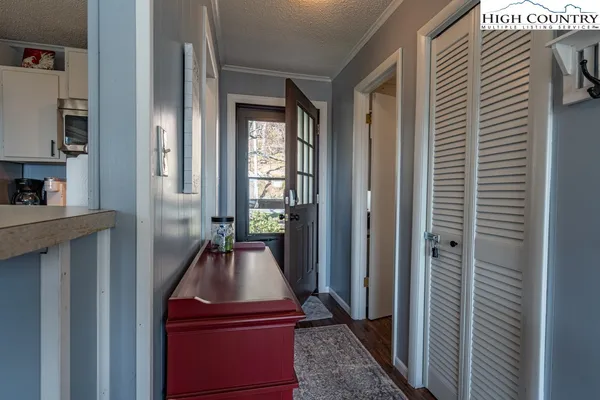 a view of a room that has a bed in it