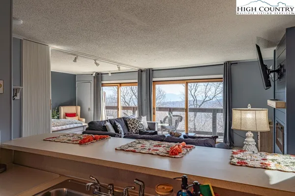 a room with furniture and a flat screen tv