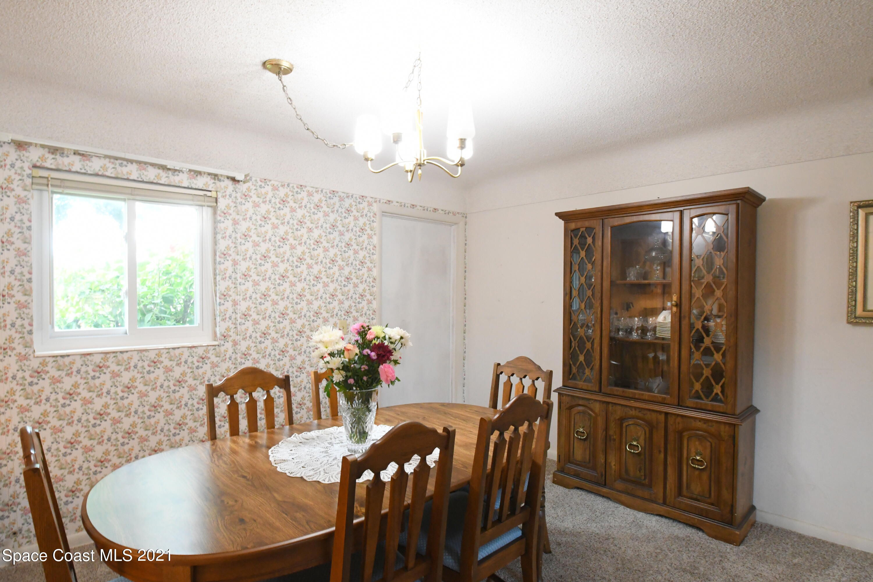1871 Pinewood Road Melbourne, FL 32934 - Photo 14 of 22 a dining room with furniture and window