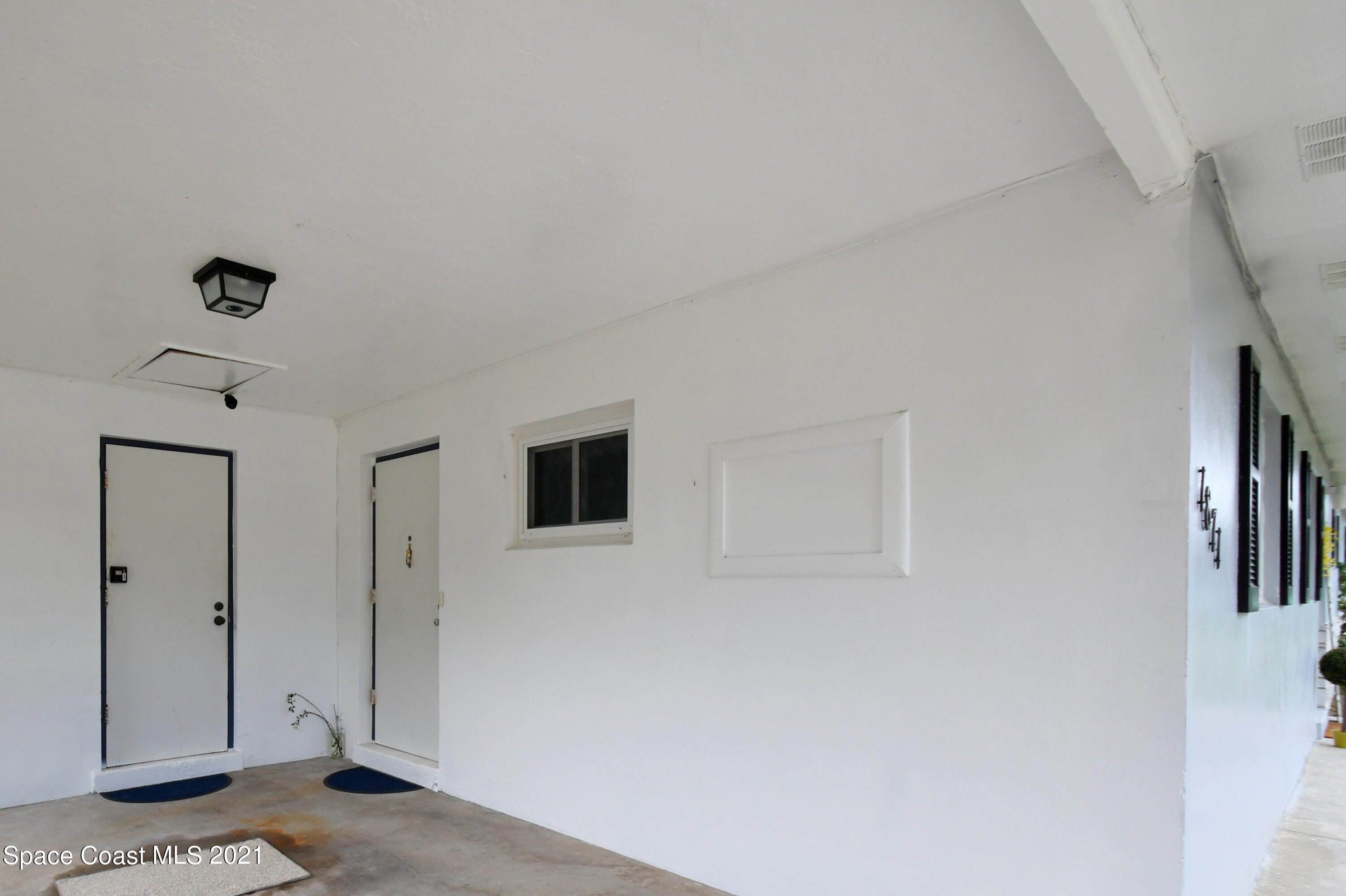 1871 Pinewood Road Melbourne, FL 32934 - Photo 19 of 22 a view of a livingroom with an empty space and a workspace