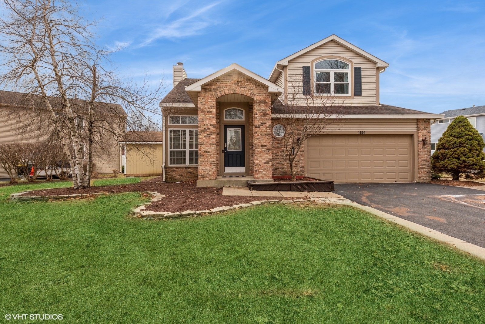1191 Starwood Pass Lake In The Hills, IL 60156 - Photo 1 of 16 a front view of a house with a yard