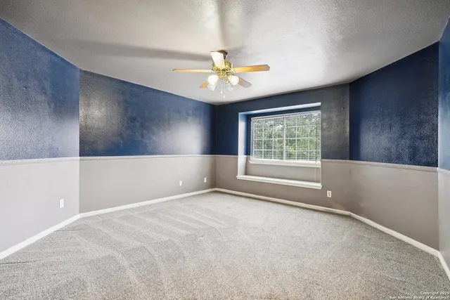 a bathroom with a sink a toilet a mirror and vanity