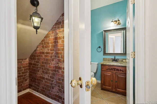 a view of a kitchen with sink and cabinets