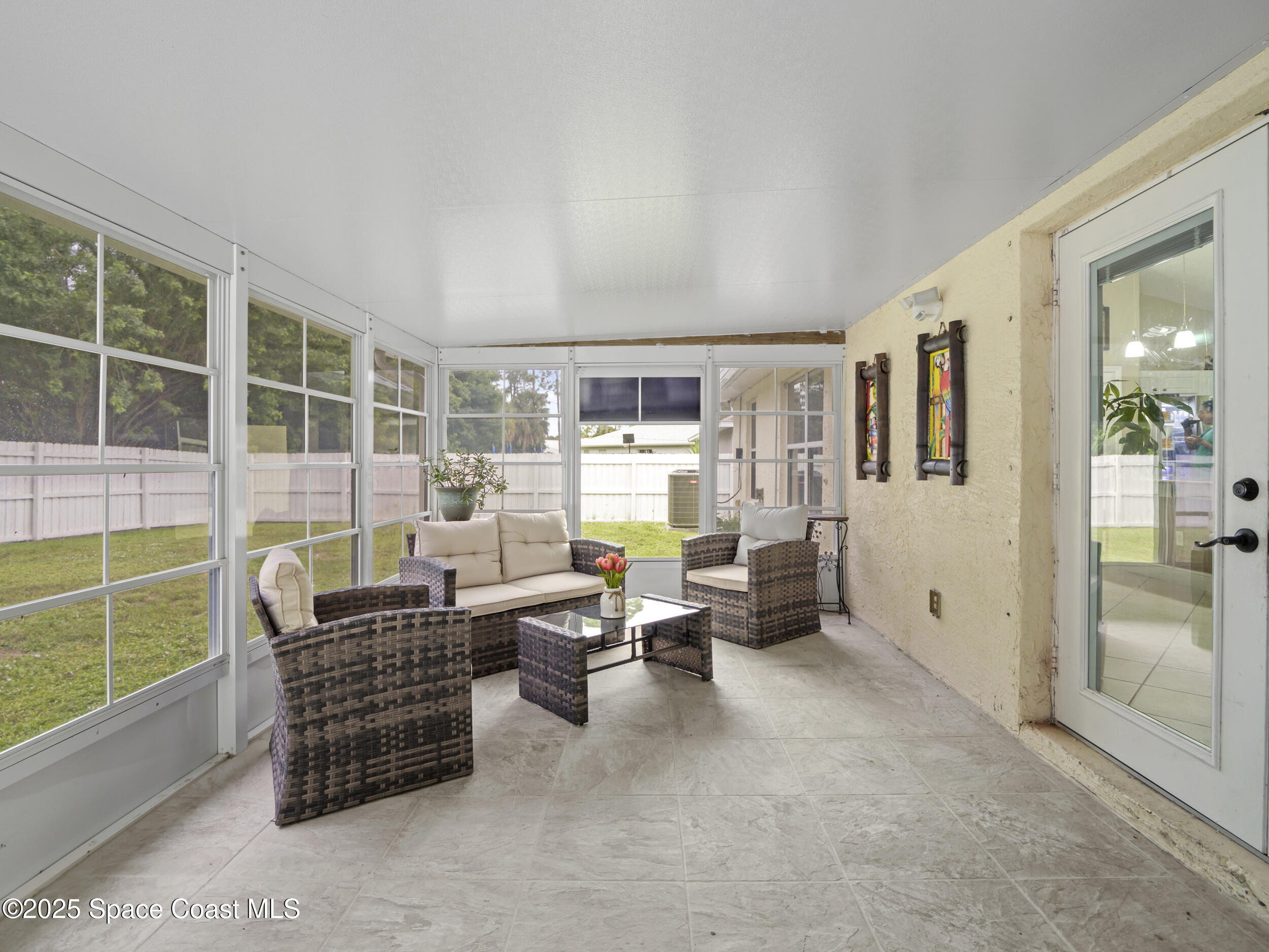 860 Tupelo Road Southwest Palm Bay, FL 32908 - Photo 20 of 26 a living room with furniture and a window