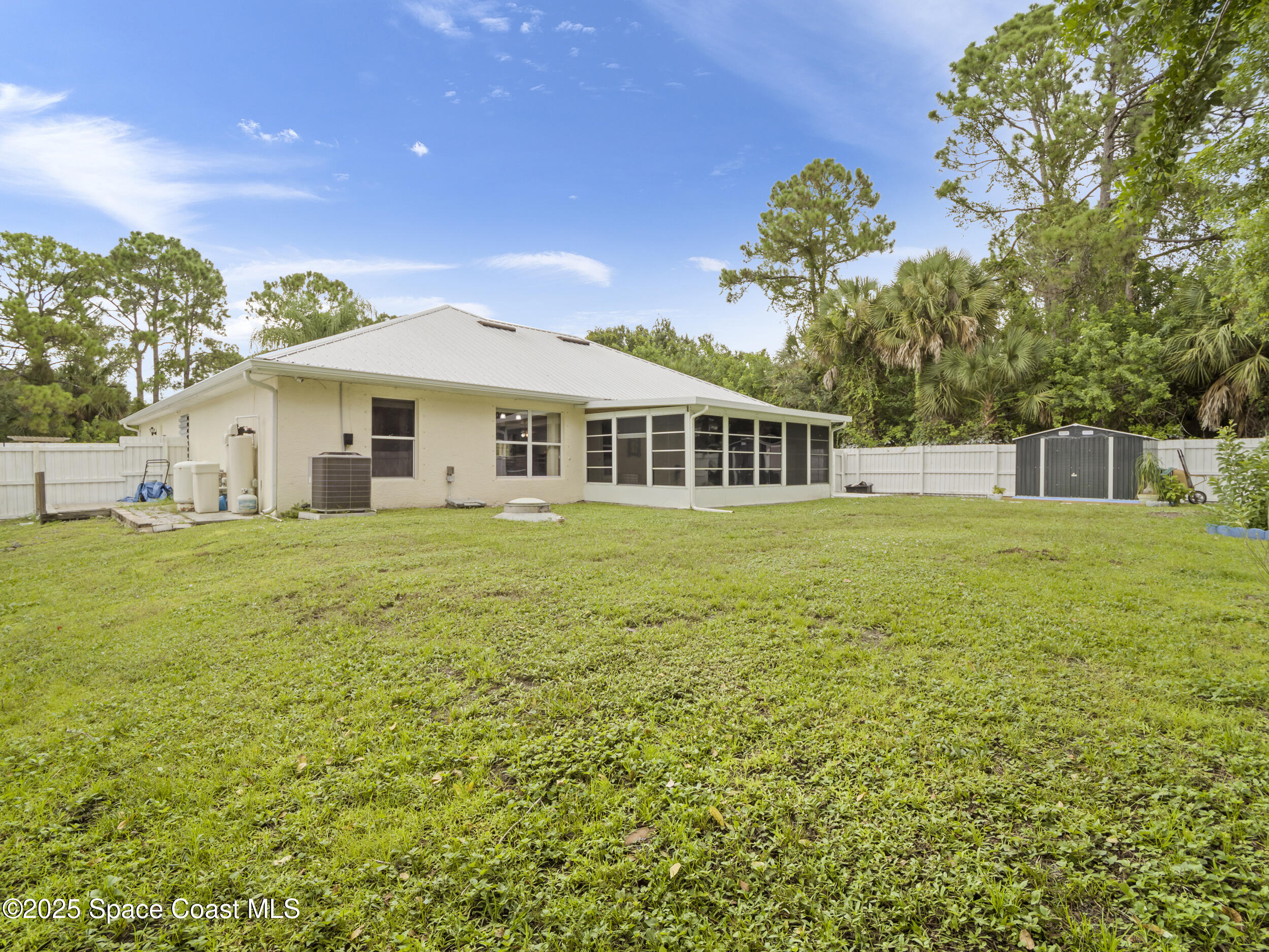 860 Tupelo Road Southwest Palm Bay, FL 32908 - Photo 21 of 26 a view of a house with a big yard
