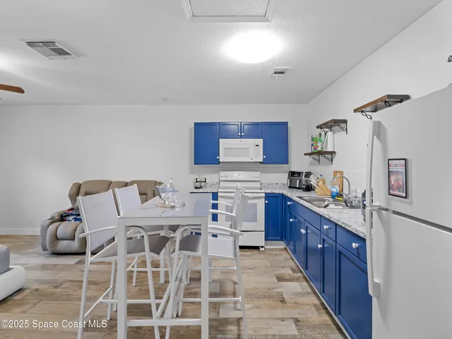 a large kitchen with cabinets