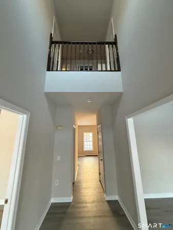 a view of staircase with white walls