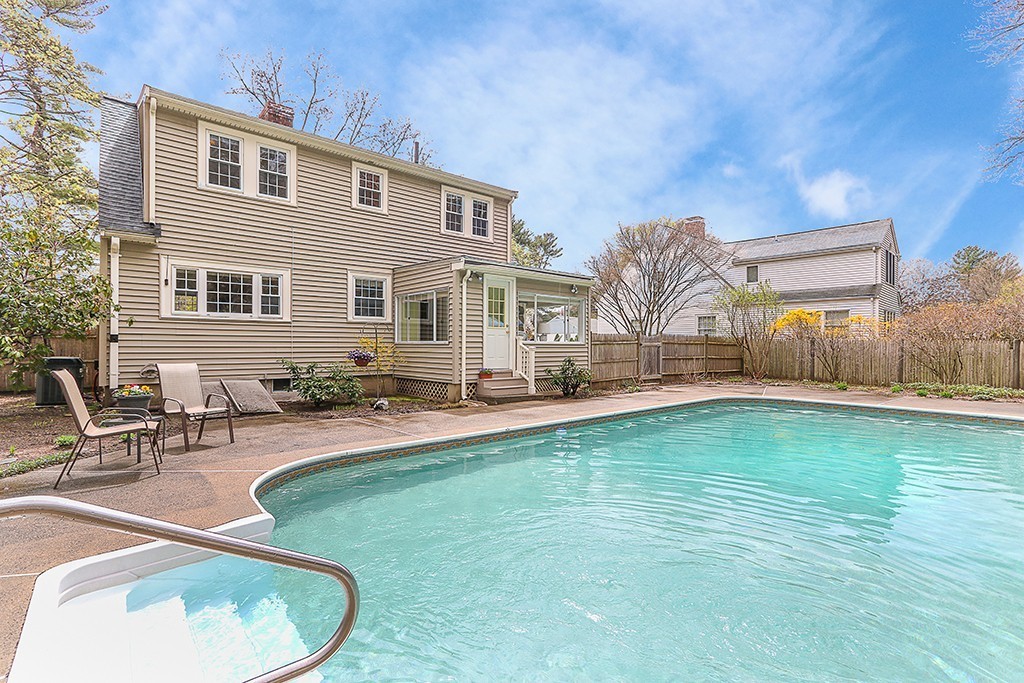 28 Clearwater Road Newton, MA 02462 - Photo 20 of 20 a swimming pool with outdoor seating and yard