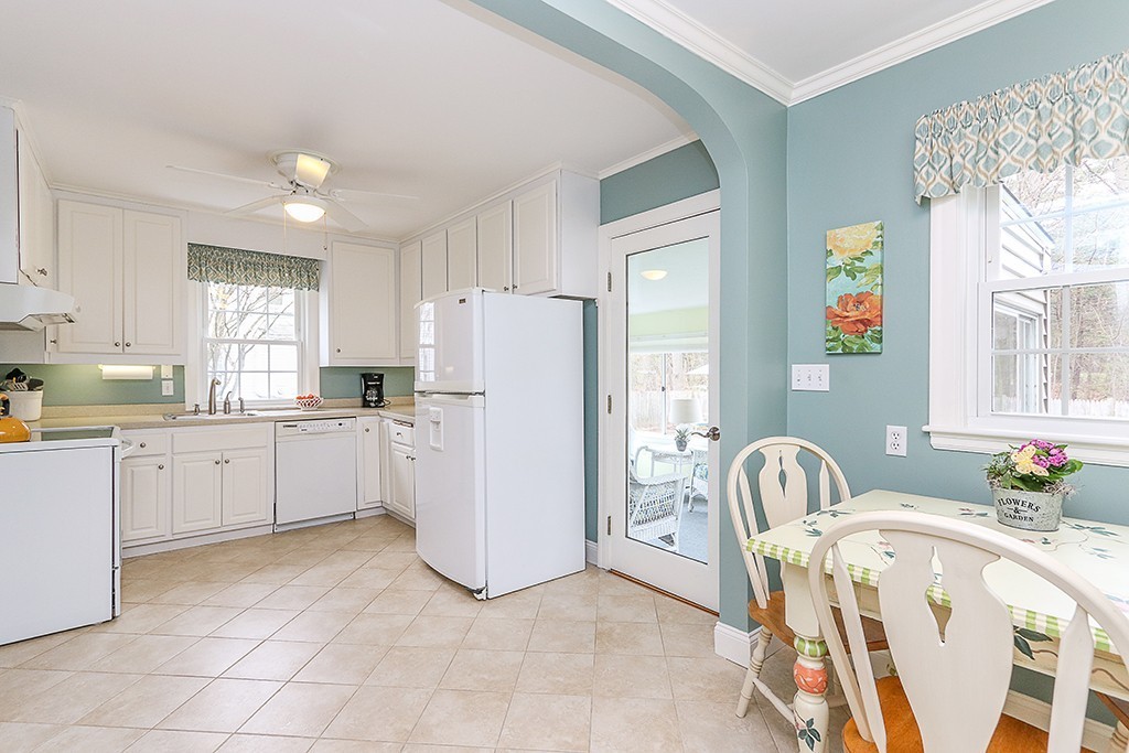 28 Clearwater Road Newton, MA 02462 - Photo 9 of 20 a kitchen with white cabinets and refrigerator