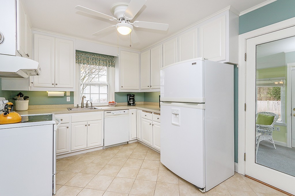 28 Clearwater Road Newton, MA 02462 - Photo 10 of 20 a kitchen with white cabinets and white appliances