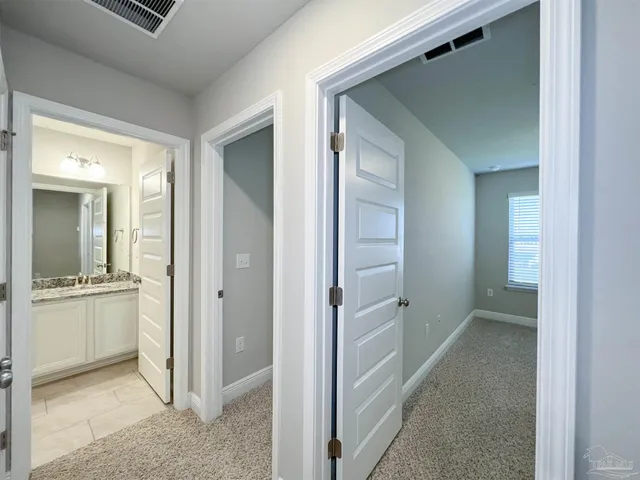an empty room with closet area