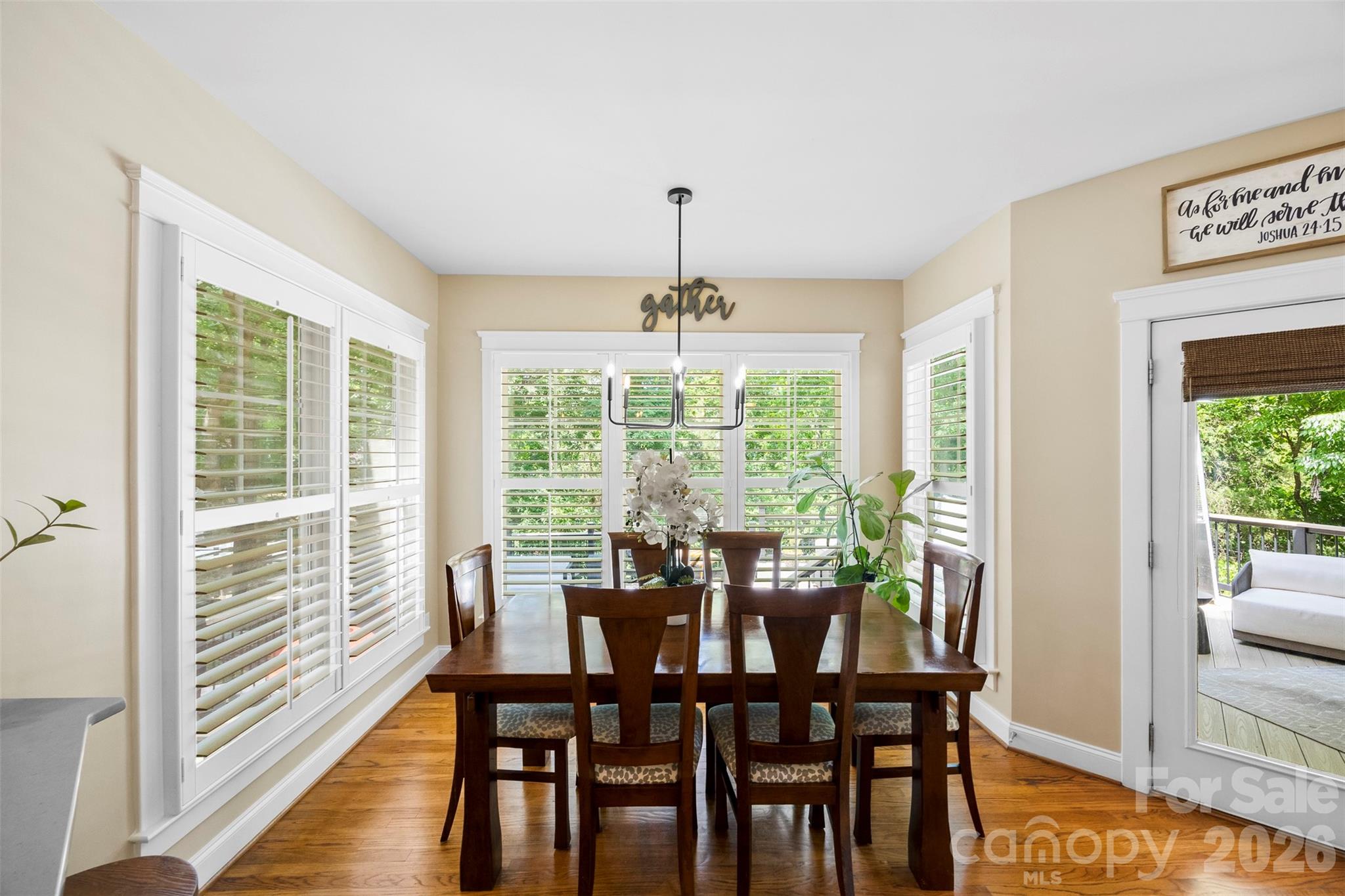 606 Andover Lane Tega Cay, SC 29708 - Photo 11 of 48 a view of a dining room with furniture window and wooden floor