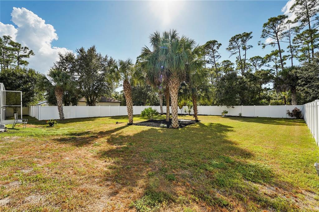 15105 Gulistan Avenue Port Charlotte, FL 33953 - Photo 31 of 39 a view of a swimming pool with an outdoor space and seating area