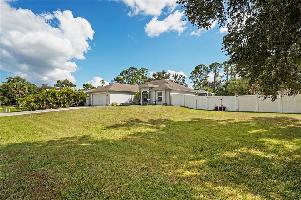 15105 Gulistan Avenue Port Charlotte, FL 33953 - Photo 4 of 39 a view of a house with a yard